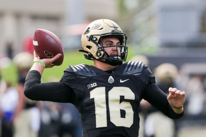 Purdue quarterback Aidan O'Connell throwing the football against Wisconsin